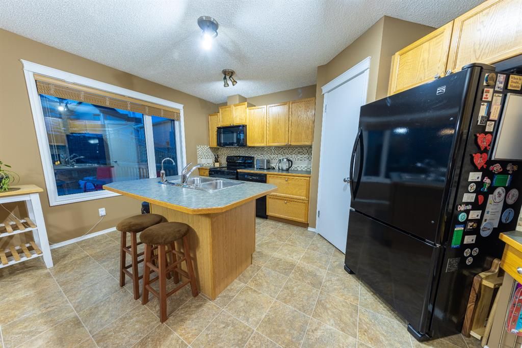 Photo 10: Photos: 83 Tuscany Springs Way NW in Calgary: Tuscany Detached for sale : MLS®# A1195730