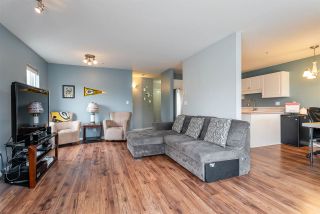 Photo 2: 204 20277 53 Avenue in Langley: Langley City Condo for sale in "The Metro II" : MLS®# R2347214