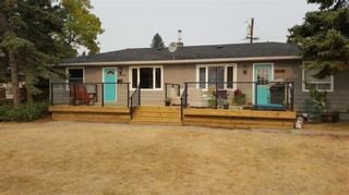 Photo 1: 6304 Bowview Road NW in Calgary: Bowness Duplex for sale : MLS®# A1038696