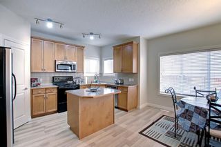Photo 6: 242 Cougar Plateau Way SW in Calgary: Cougar Ridge Detached for sale : MLS®# A2007391