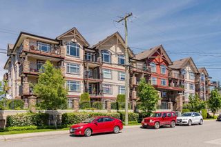 Photo 2: 409 19939 55A Avenue in Langley: Langley City Condo for sale : MLS®# R2859234