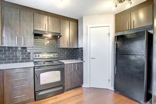 Photo 7: 104 2445 Kingsland Road SE: Airdrie Row/Townhouse for sale : MLS®# A1240825