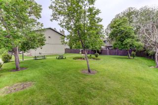 Photo 4: 2 6503 Ranchview Drive NW in Calgary: Ranchlands Row/Townhouse for sale : MLS®# A1237382