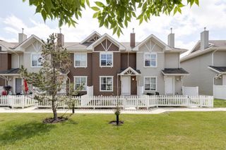 Photo 1: 208 Toscana Gardens NW in Calgary: Tuscany Row/Townhouse for sale : MLS®# A1127708