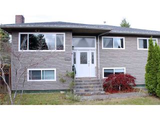 Photo 1: 1491 COMO LAKE AV in Coquitlam: Harbour Place House for sale : MLS®# V979371