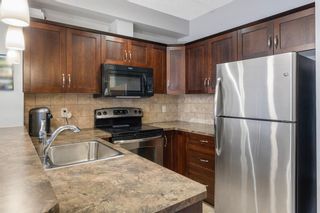 Photo 1: 310 201 Sunset Drive: Cochrane Apartment for sale : MLS®# A2033597