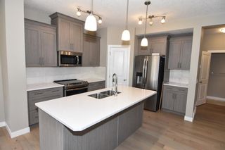 Photo 8: 215 Kinniburgh Road: Chestermere Semi Detached for sale : MLS®# A1237068