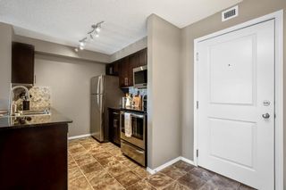 Photo 2: 8314 403 Mackenzie Way SW: Airdrie Apartment for sale : MLS®# A1258232