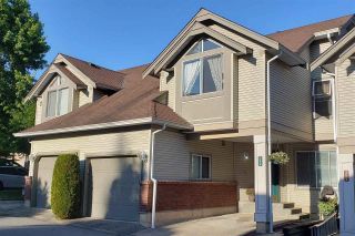 Photo 1: 306 13900 HYLAND Road in Surrey: East Newton Townhouse for sale in "Hyland Grove" : MLS®# R2742950