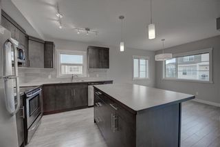 Photo 1: 405 Redstone View NE in Calgary: Redstone Row/Townhouse for sale : MLS®# A1224923