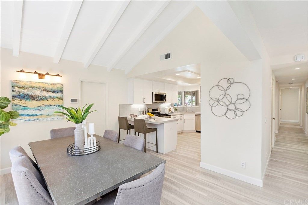 Beautifully remodeled open concept home!  Just look at that vaulted, beamed ceiling!