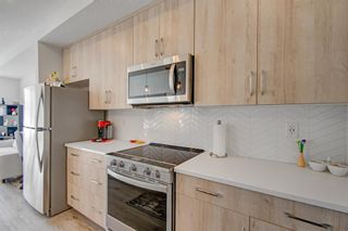 Photo 2: 304 71 Shawnee Common SW in Calgary: Shawnee Slopes Apartment for sale : MLS®# A2027127