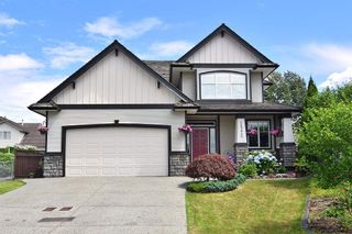 Photo 1: 18372 66 Avenue in Surrey: Cloverdale BC House for sale in "CLOVERWOODS" (Cloverdale)  : MLS®# R2186077