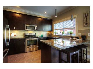 Photo 1: 28 1130 EWEN Avenue in New Westminster: Queensborough Townhouse for sale in "GLADSTONE PARK" : MLS®# V942329