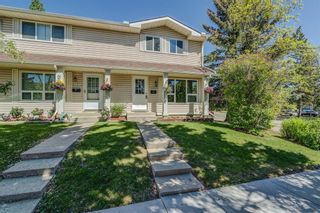 Photo 1: 199 Woodmont Terrace SW in Calgary: Woodbine Row/Townhouse for sale : MLS®# A1229565