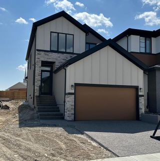 Photo 1: 17 Coulee Crescent SW in Calgary: Cougar Ridge Detached for sale : MLS®# A2048455