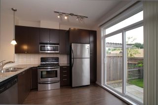 Photo 1: 138 18777 68A Avenue in Surrey: Clayton Townhouse for sale in "COMPASS" (Cloverdale)  : MLS®# R2419589