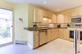 Photo 8: 205 33401 MAYFAIR Avenue in Abbotsford: Central Abbotsford Condo for sale in "MAYFAIR GARDENS" : MLS®# R2611471