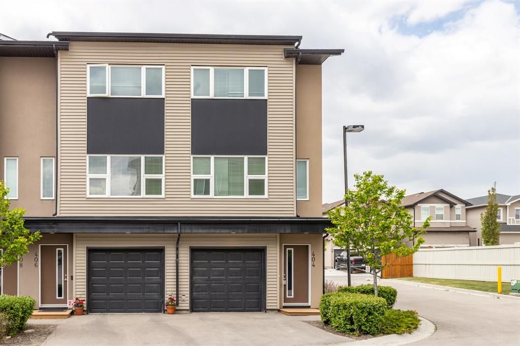 Main Photo: 404 Covecreek Circle NE in Calgary: Coventry Hills Row/Townhouse for sale : MLS®# A1217696