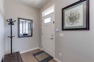 Photo 4: 214 Panatella Walk NW in Calgary: Panorama Hills Row/Townhouse for sale : MLS®# A1225557