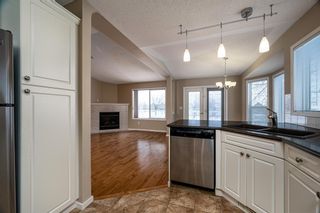 Photo 9: 30 Signature Manor SW in Calgary: Signal Hill Row/Townhouse for sale : MLS®# A1186466