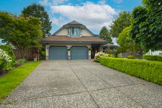Photo 1: 3393 198A Street in Langley: Brookswood Langley House for sale in "MEADOWBROOK" : MLS®# R2693395
