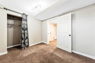 Photo 18: 13 Woodhill Court SW in Calgary: Woodlands Row/Townhouse for sale : MLS®# A1209374