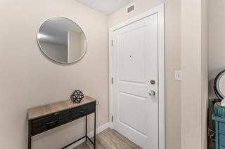 Photo 2: 4102 403 Mackenzie Way SW: Airdrie Apartment for sale : MLS®# A2142671