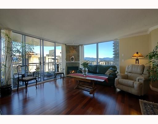 Bright, spacious living room with S/D to 1st balcony boasting CITY and MOUNTAIN VIEWS!