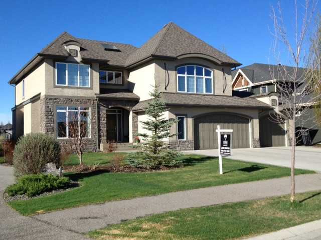 Welcome to 12 Heritage Lake Shores.  A beautiful, estate home backing on to the upper pond at The Lake @ Heritage Pointe.