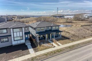 Photo 34: 37 River Heights Drive: Cochrane Semi Detached (Half Duplex) for sale : MLS®# A2130528