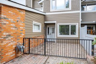 Photo 2: 74 Woodmeadow Close SW in Calgary: Woodlands Row/Townhouse for sale : MLS®# A2044732