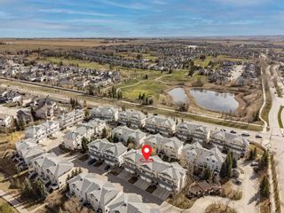 Photo 27: 21 Crystal Shores Cove: Okotoks Row/Townhouse for sale : MLS®# A2126777