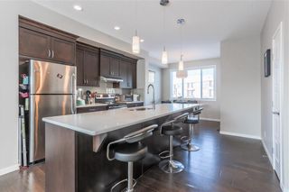 Photo 5: 153 PANATELLA Square NW in Calgary: Panorama Hills Row/Townhouse for sale : MLS®# C4305575