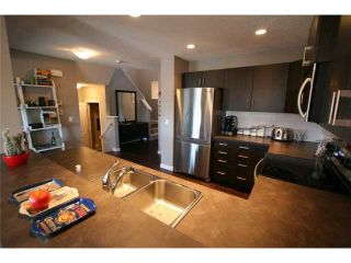 Photo 6: 225 SUNSET Common: Cochrane Residential Attached for sale : MLS®# C3590396