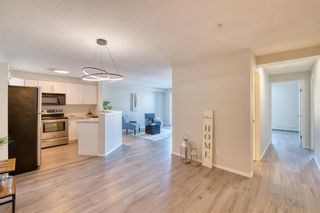 Photo 3: 7203 304 Mackenzie Way SW: Airdrie Apartment for sale : MLS®# A2032823