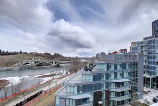 Photo 1: 404 138 Waterfront Court SW in Calgary: Eau Claire Apartment for sale : MLS®# A1211169