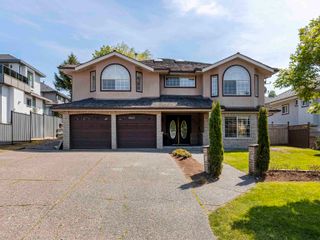 Photo 1: 8310 150 Street in Surrey: Bear Creek Green Timbers House for sale : MLS®# R2780994