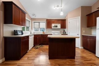 Photo 2: 1298 23 Avenue: Didsbury Semi Detached (Half Duplex) for sale : MLS®# A1250896