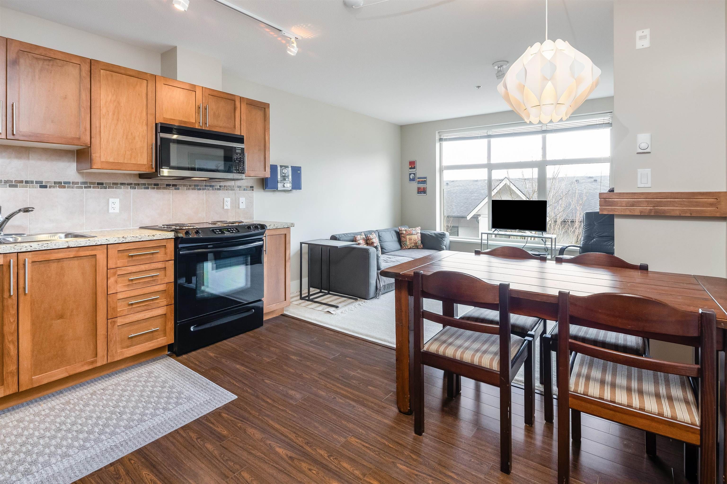 Main Photo: 319 1211 VILLAGE GREEN Way in Squamish: Downtown SQ Condo for sale in "Rockcliff" : MLS®# R2759438