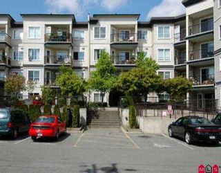 Photo 1: 408 5765 GLOVER RD in Langley: Langley City Condo for sale in "COLLEGE COURT" : MLS®# F2608731