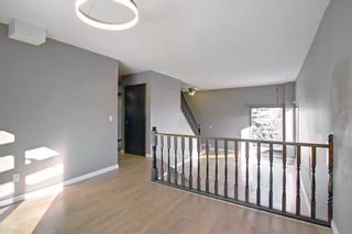 Photo 8: 32 Coach Manor Rise SW in Calgary: Coach Hill Detached for sale : MLS®# A2011473