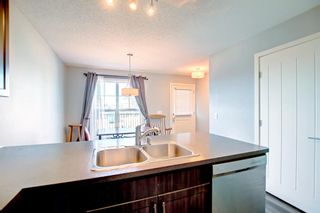 Photo 10: 725 101 Sunset Drive: Cochrane Row/Townhouse for sale : MLS®# A1258770