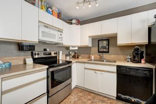 Photo 8: 2 123 Queensland Drive SE in Calgary: Queensland Row/Townhouse for sale : MLS®# A2010360