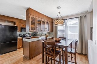 Photo 12: 411 Queensland Circle SE in Calgary: Queensland Detached for sale : MLS®# A1193029