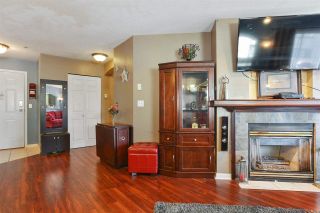Photo 5: 307 20120 56 Avenue in Langley: Langley City Condo for sale in "Blackberry Lane" : MLS®# R2211534