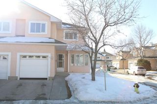 Photo 1: 51 388 Sandarac Drive NW in Calgary: Sandstone Valley Row/Townhouse for sale : MLS®# A2034090