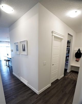 Photo 7: 213 Crestmont Drive SW in Calgary: Crestmont Detached for sale : MLS®# A2041791