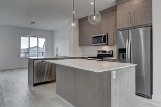 Photo 5: 202 335 Creekside Boulevard in Calgary: C-168 Row/Townhouse for sale : MLS®# A2124779