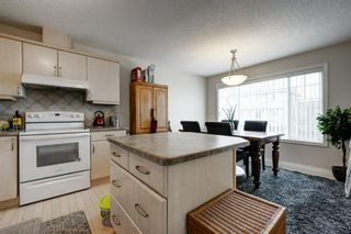 Photo 6: 10 Crystal Shores Cove: Okotoks Row/Townhouse for sale : MLS®# A1217849